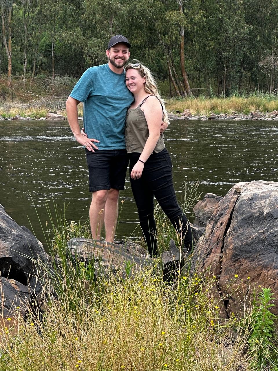 Amy and Andrew together beside a river