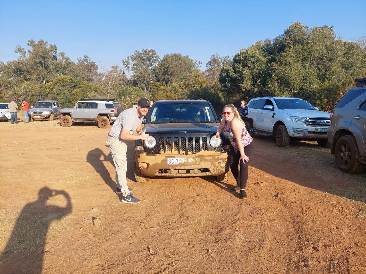 Amy and Andrew with their Jeep on an outdoor adventure